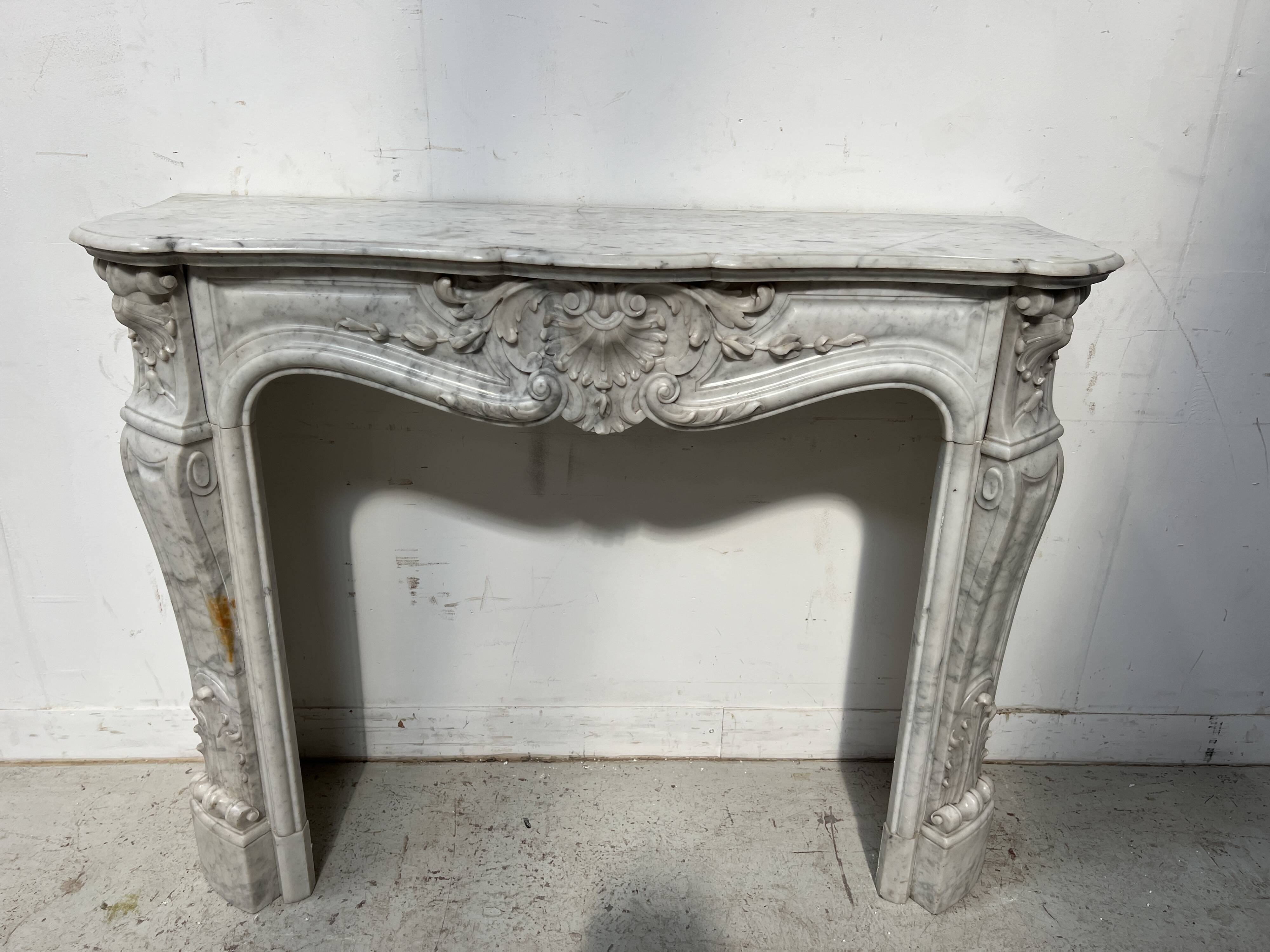Louis XV style white Carrara marble fireplace, 19th century.