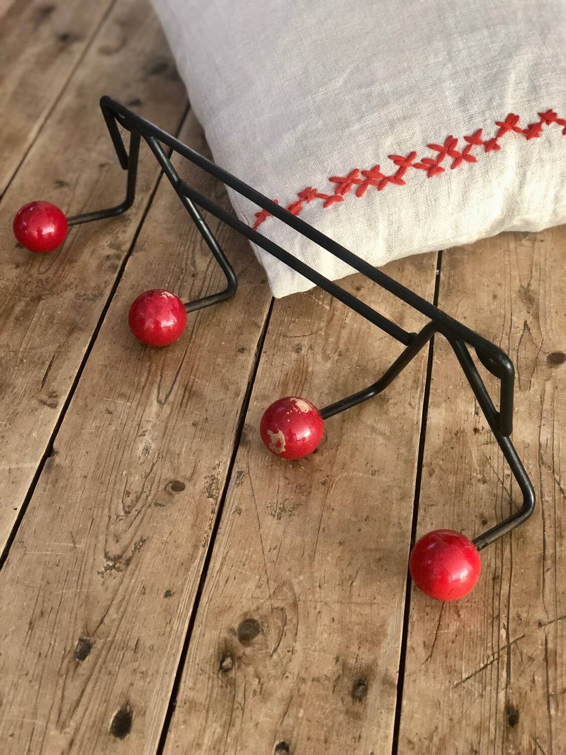 Red and black coat rack