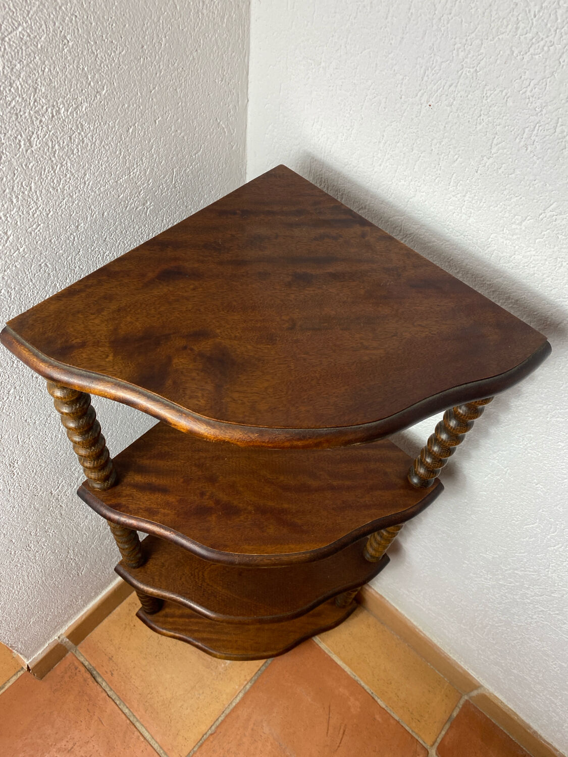 Corner shelf on a turned wooden stand