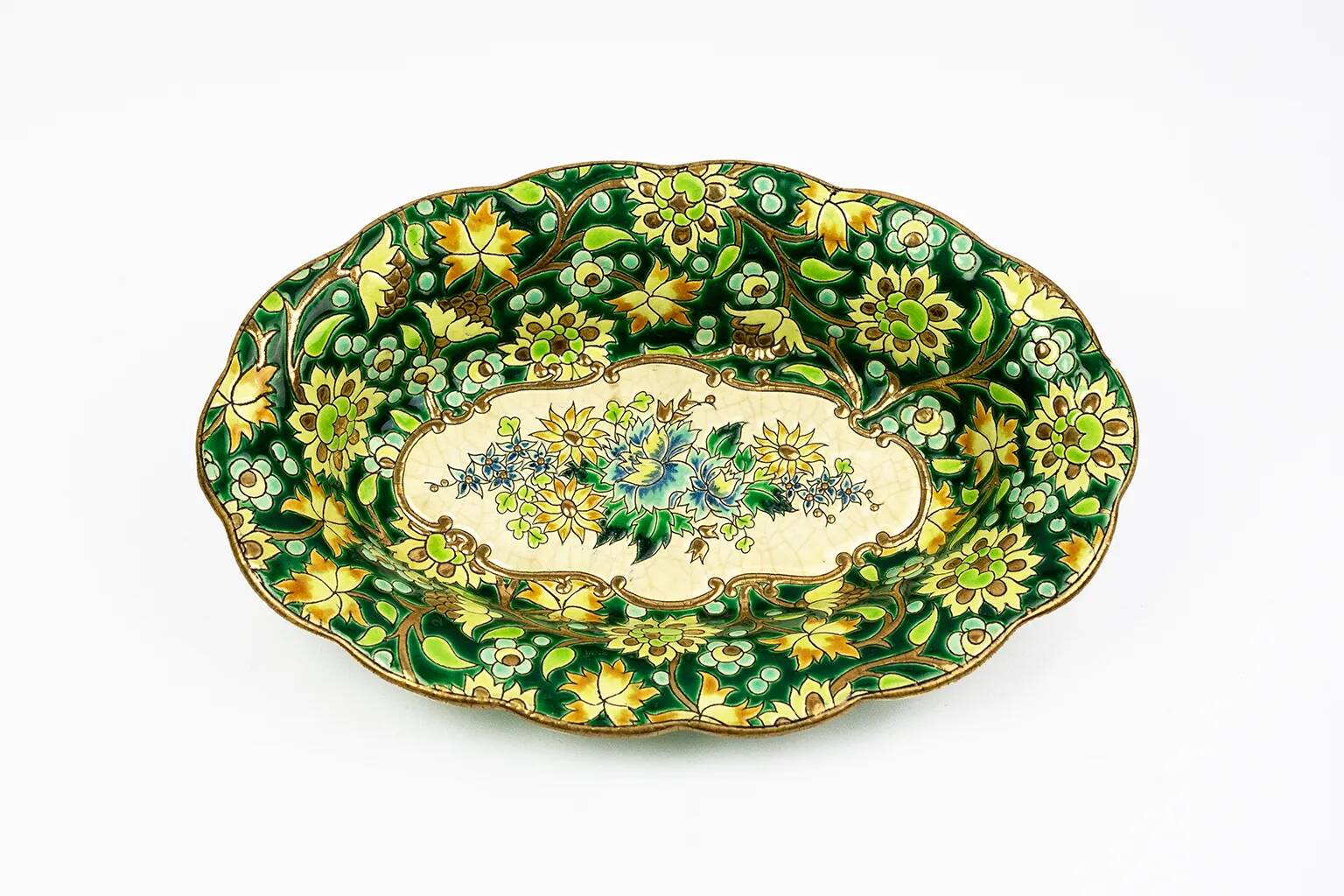 Longwy cup in cloisonné enamels on a green background, polychrome floral decoration and gold