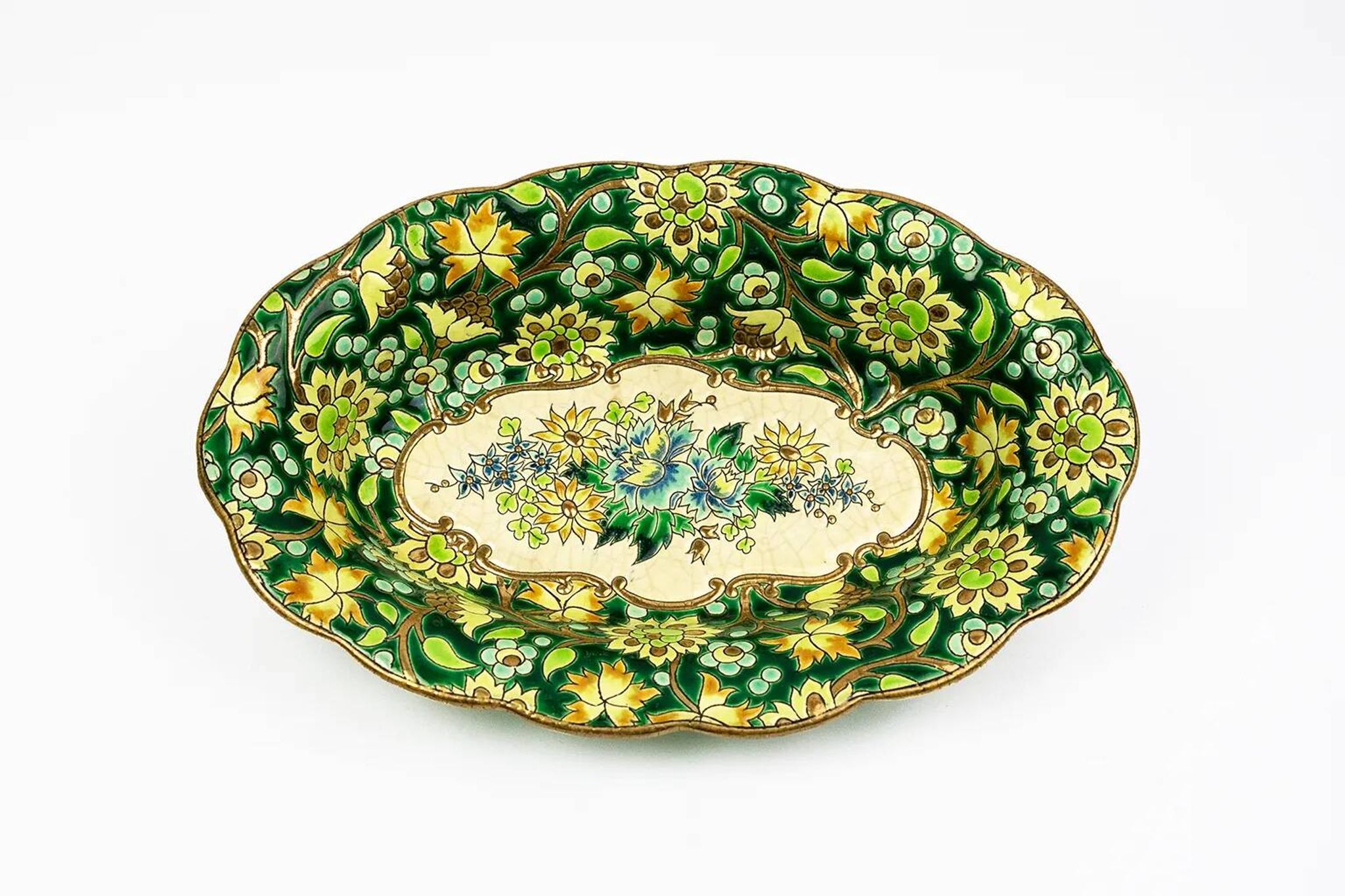 Longwy cup in cloisonné enamels on a green background, polychrome floral decoration and gold