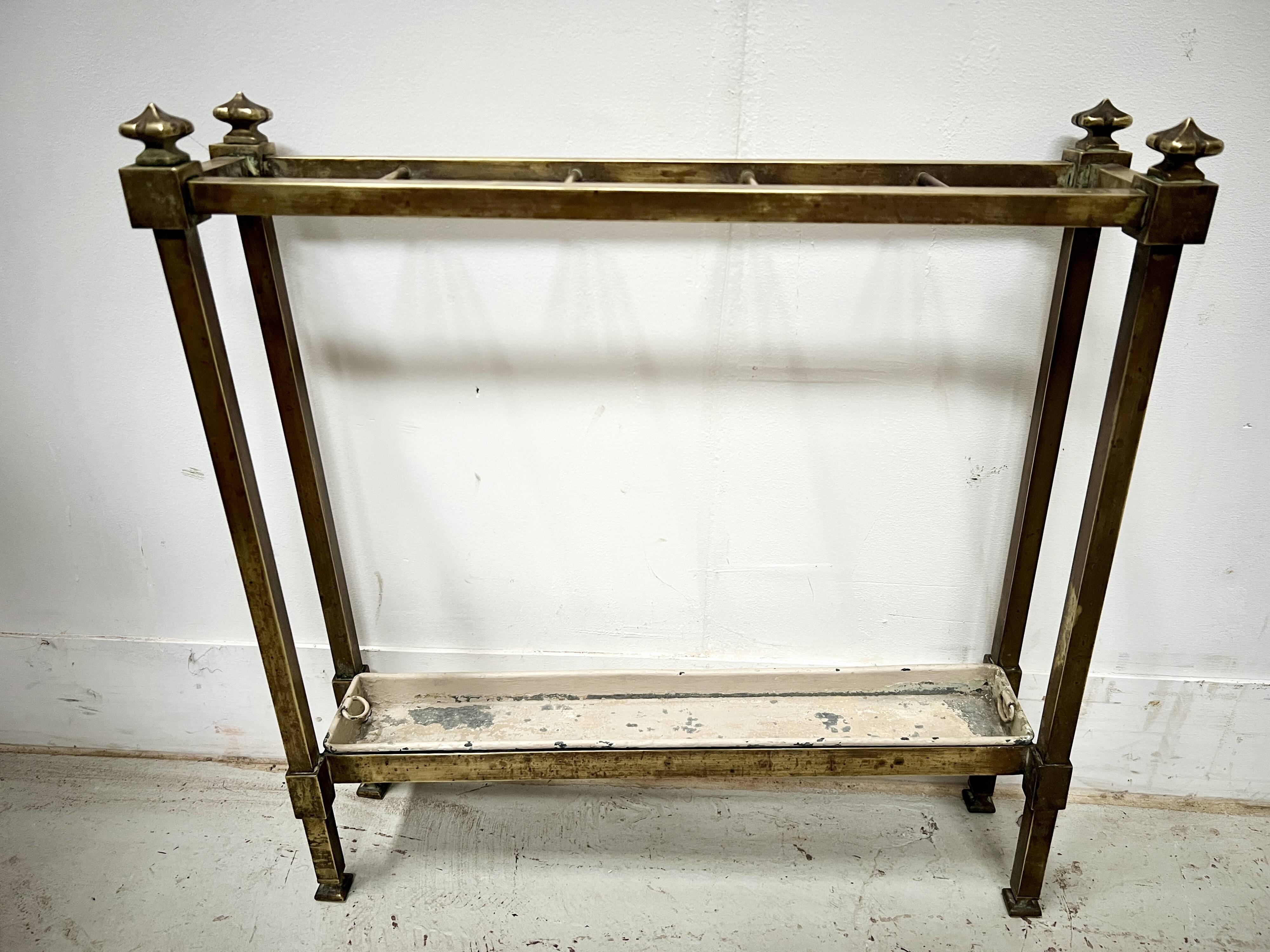 Brass and sheet metal umbrella stands from the 20th century.