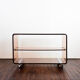Table d'appoint sur roues en plexi fumé