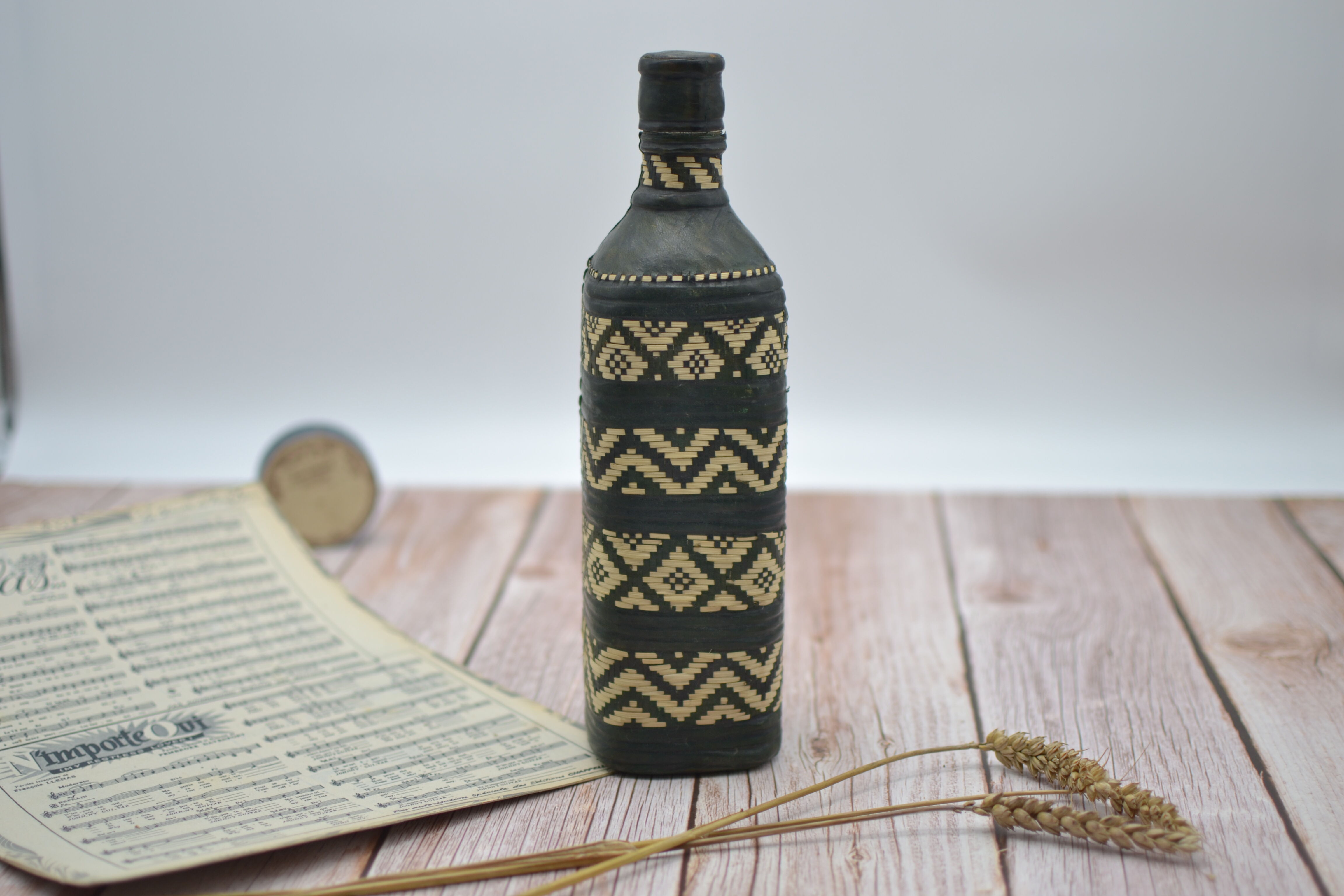 Set of 2 decorative vintage bottles covered with leather & wicker