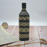Set of 2 decorative vintage bottles covered with leather & wicker
