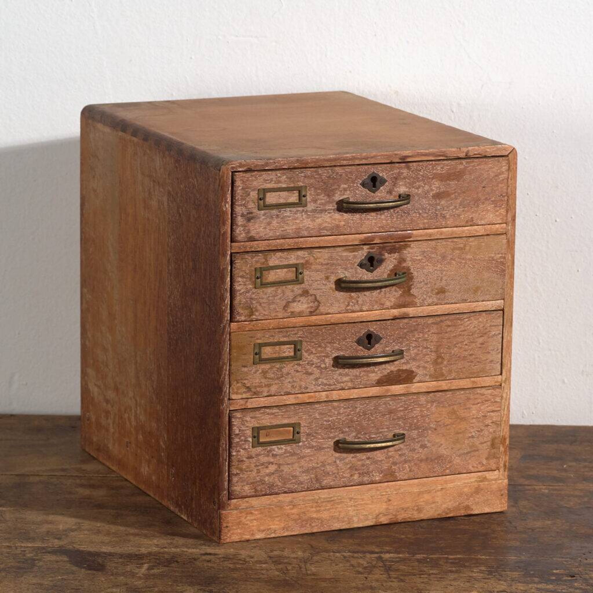 Small Japanese desk chest in oak and red pine, mid-Showa period, circa 1945–1970.