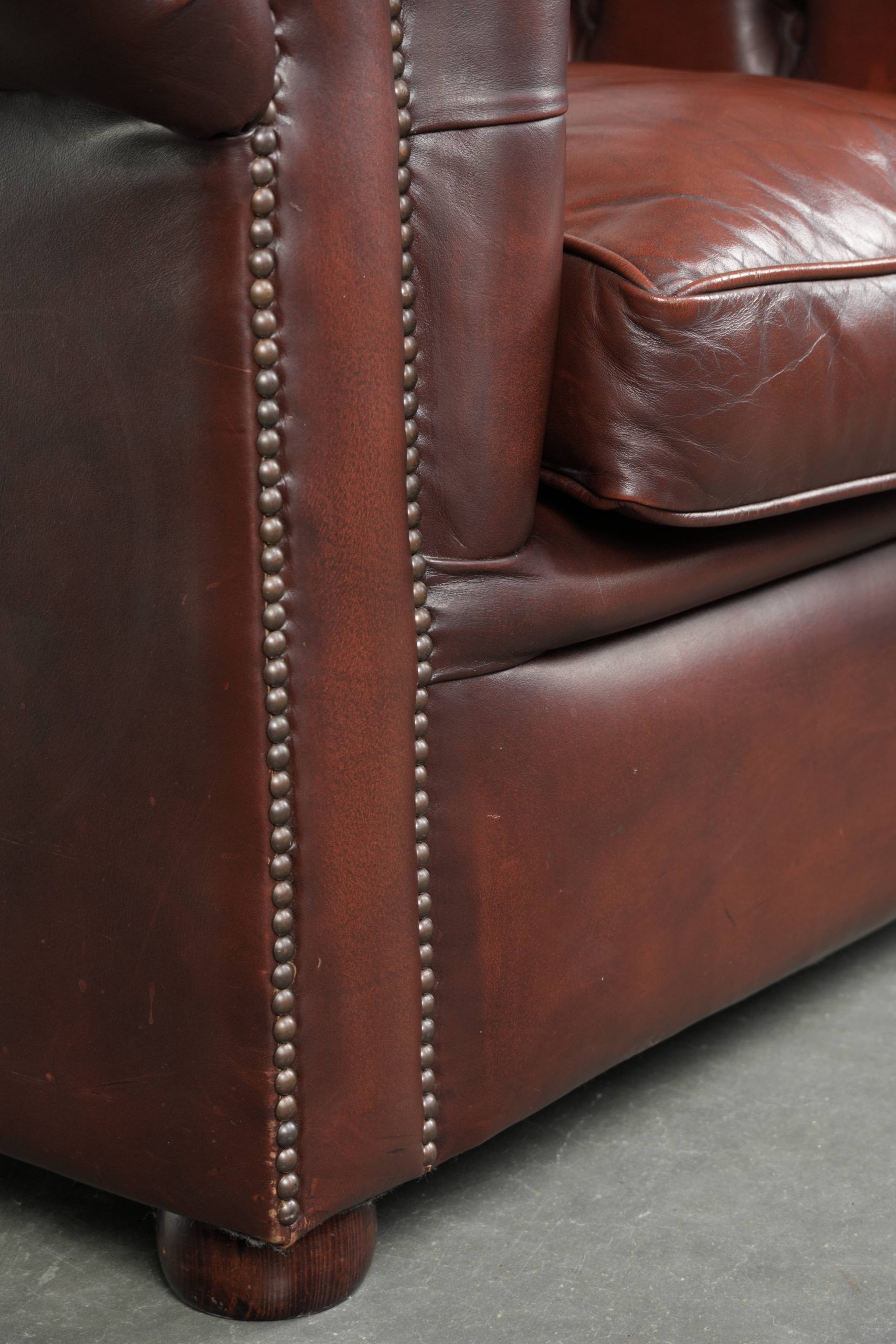 Cowhide Chesterfield armchair in a classic English style