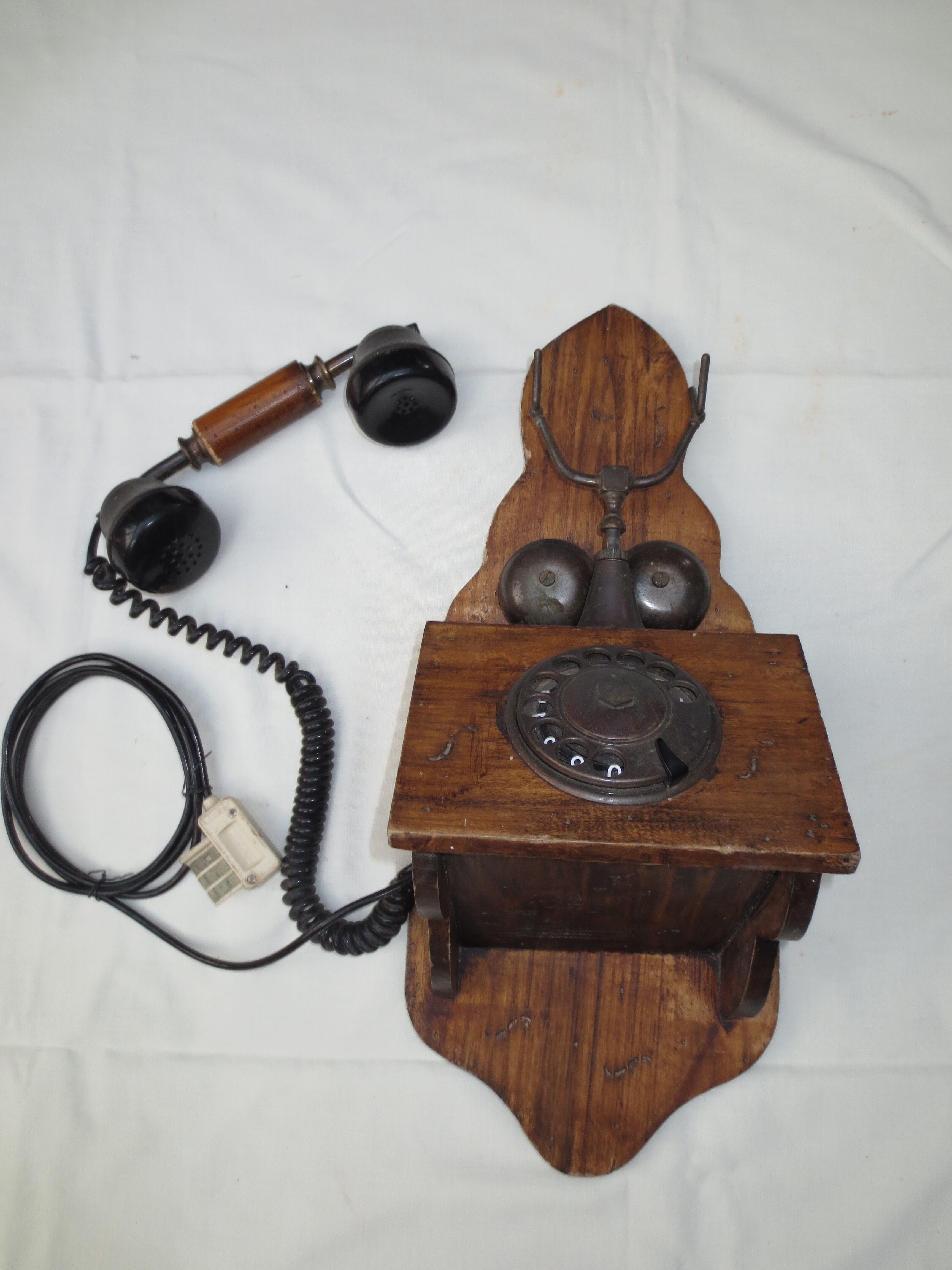Old wood and metal wall phone