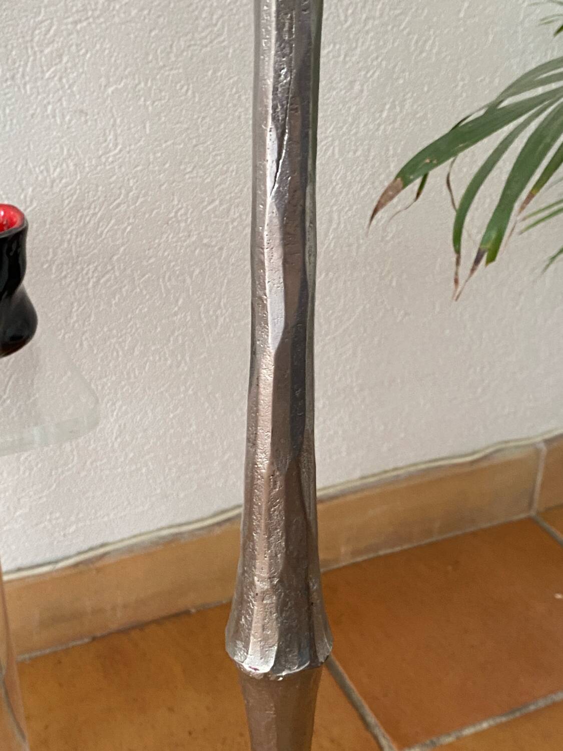 Large silver-plated candlestick on a stand