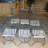 Wrought iron and bevelled glass table with 6 matching chairs.
