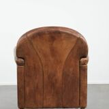 Beautiful vintage sheep leather armchair with a characterful appearance