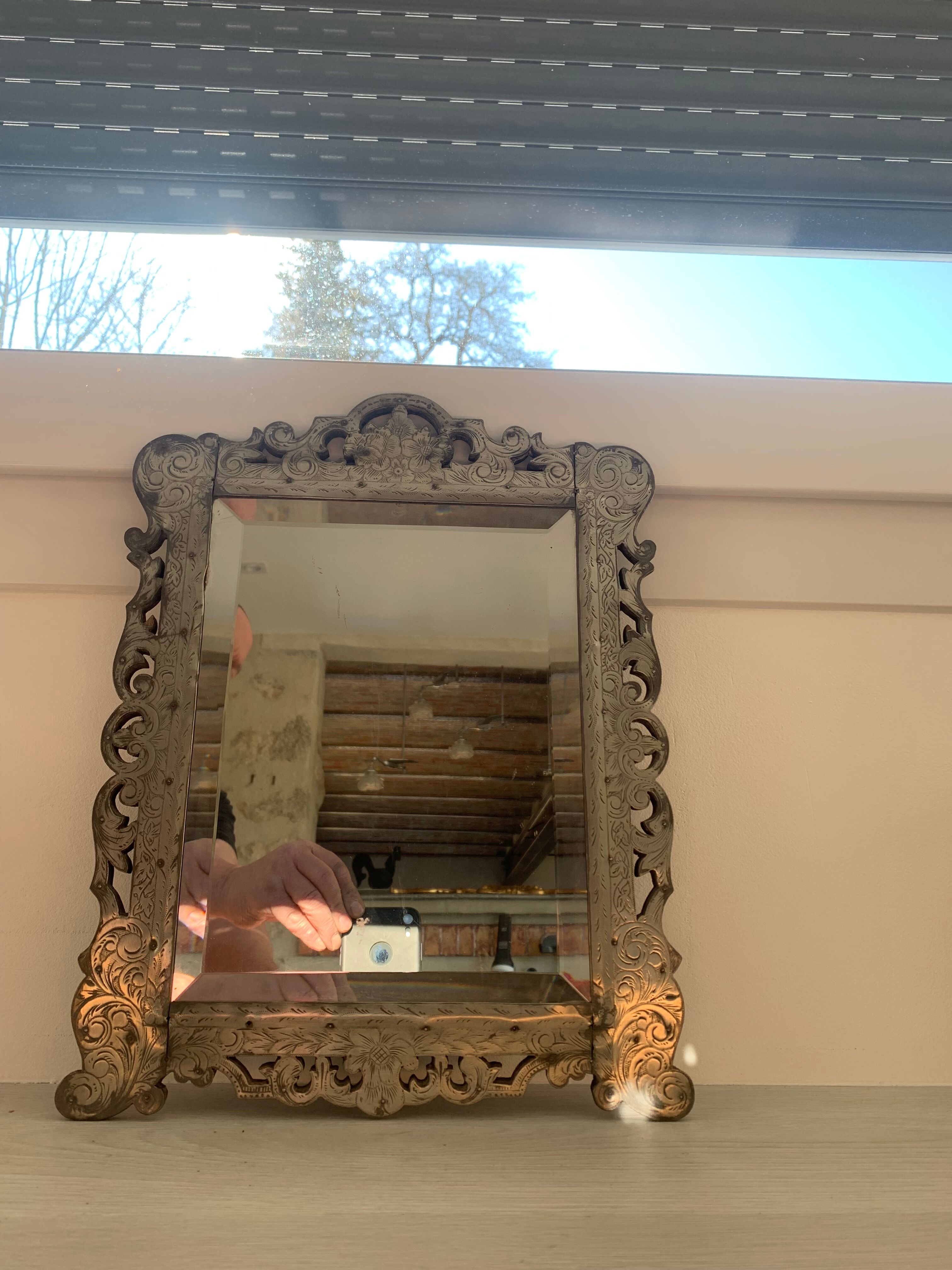 Eventful beveled mirror and openwork period 1900 repelled tin decoration