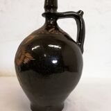 Jug in varnished sandstone