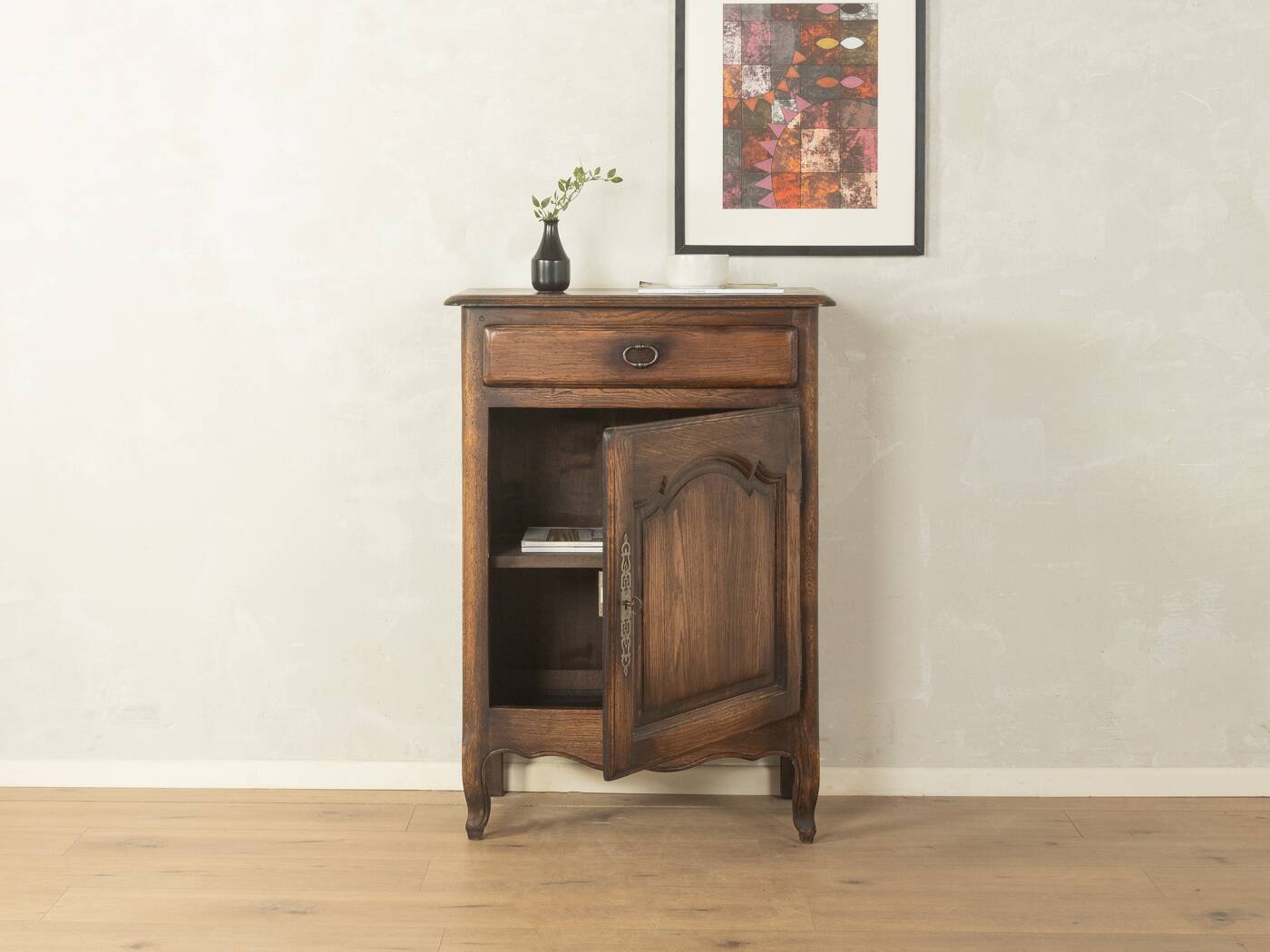 Antique chest of drawers with curved silhouette and patina