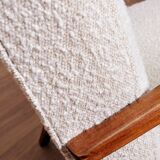 Vintage armchair in pearl white bouclé with walnut wood, 1960.