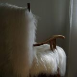 Pair of Scandinavian armchairs in oak and long-haired Icelandic sheepskin by Henning Kjærnulf, 1950.