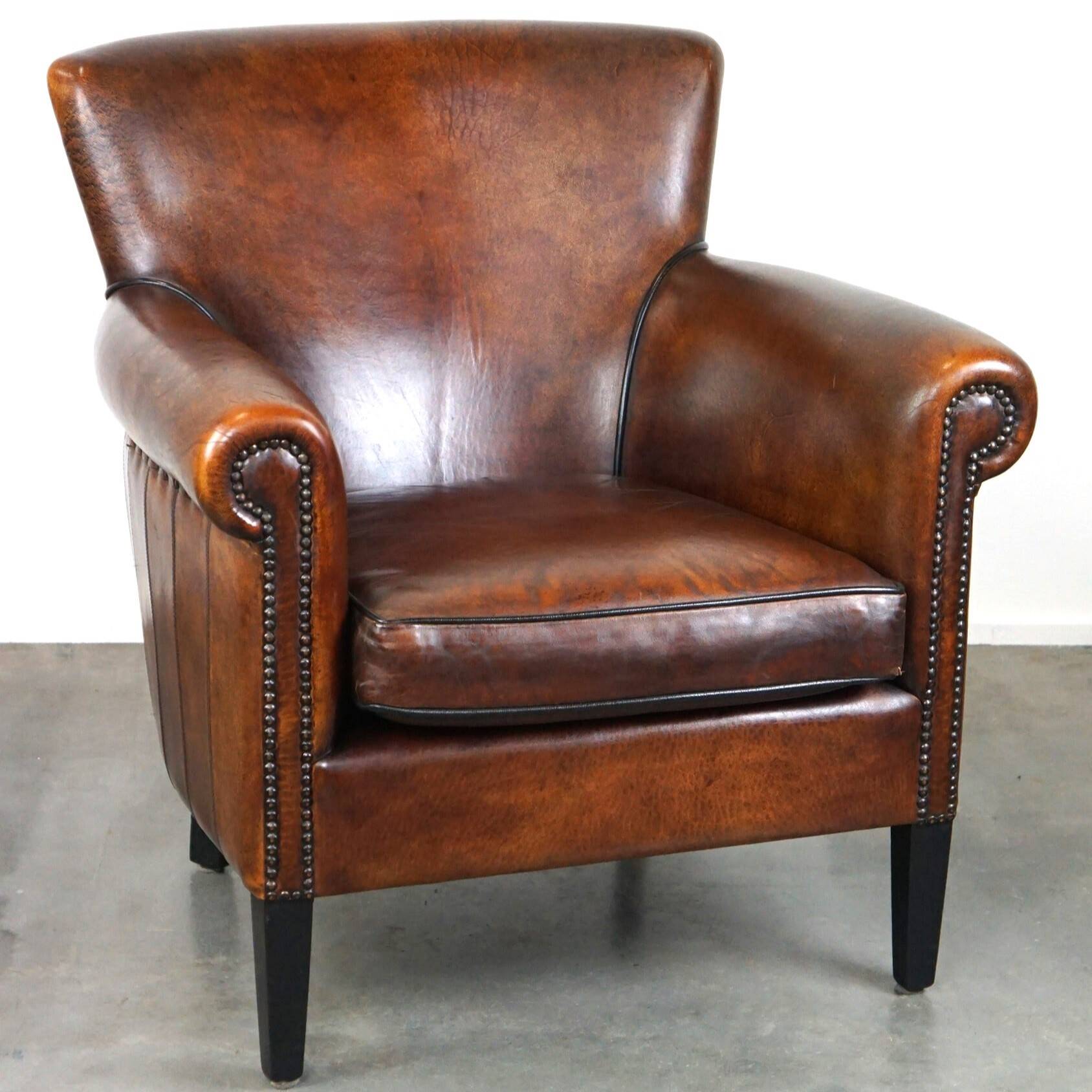 Stylish sheepskin leather armchair with a refined appearance