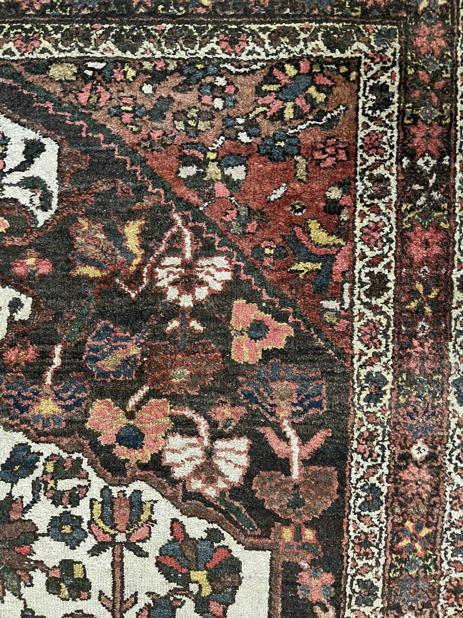 Antique handmade Hamadan Persian rug, ivory medallion on dark background 148x103.