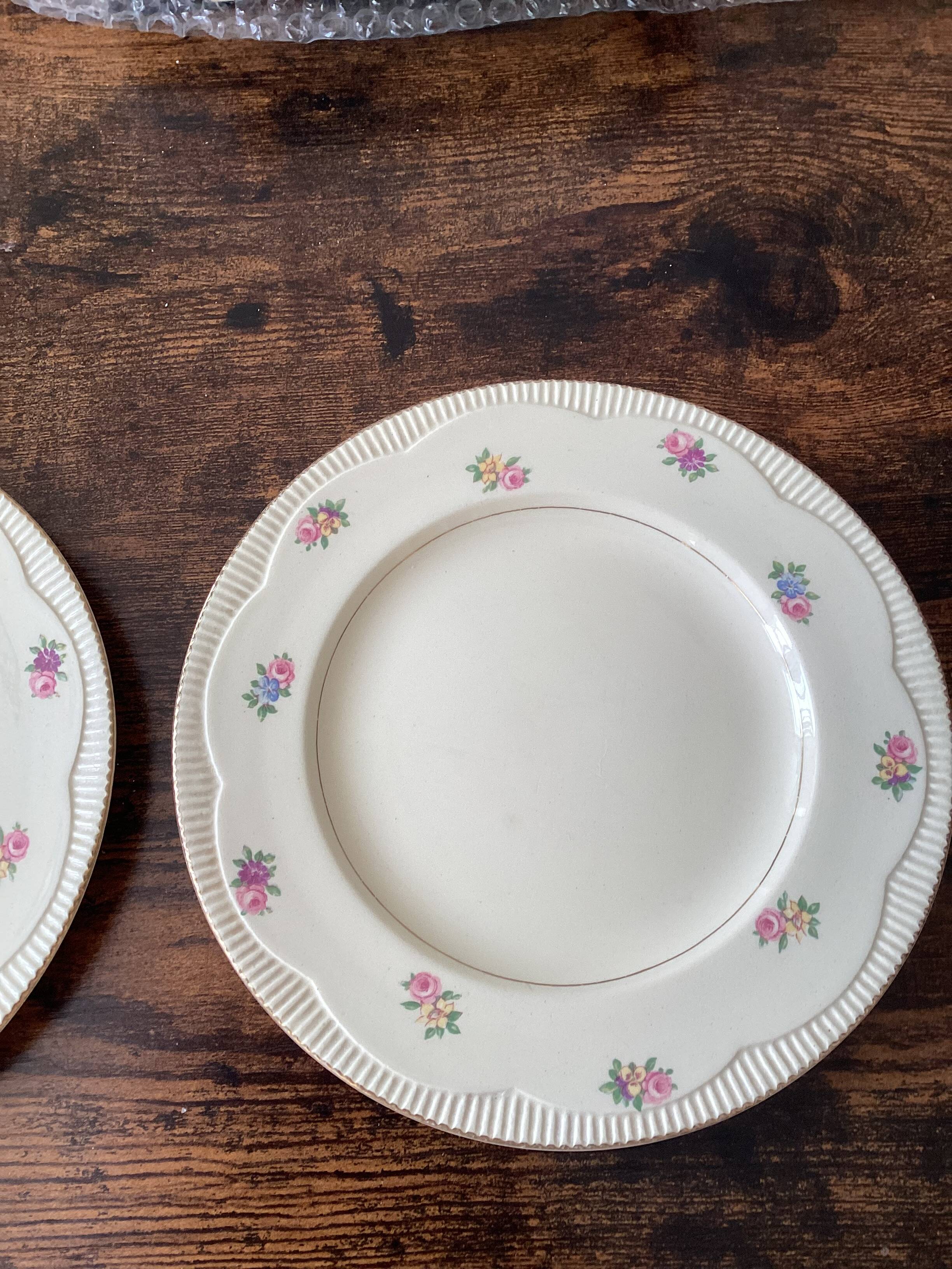 Two identical vintage Clarice Cliff plates from the Newport Pottery.