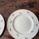 Two identical vintage Clarice Cliff plates from the Newport Pottery.