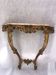 Golden console with marble in Louis XV style.