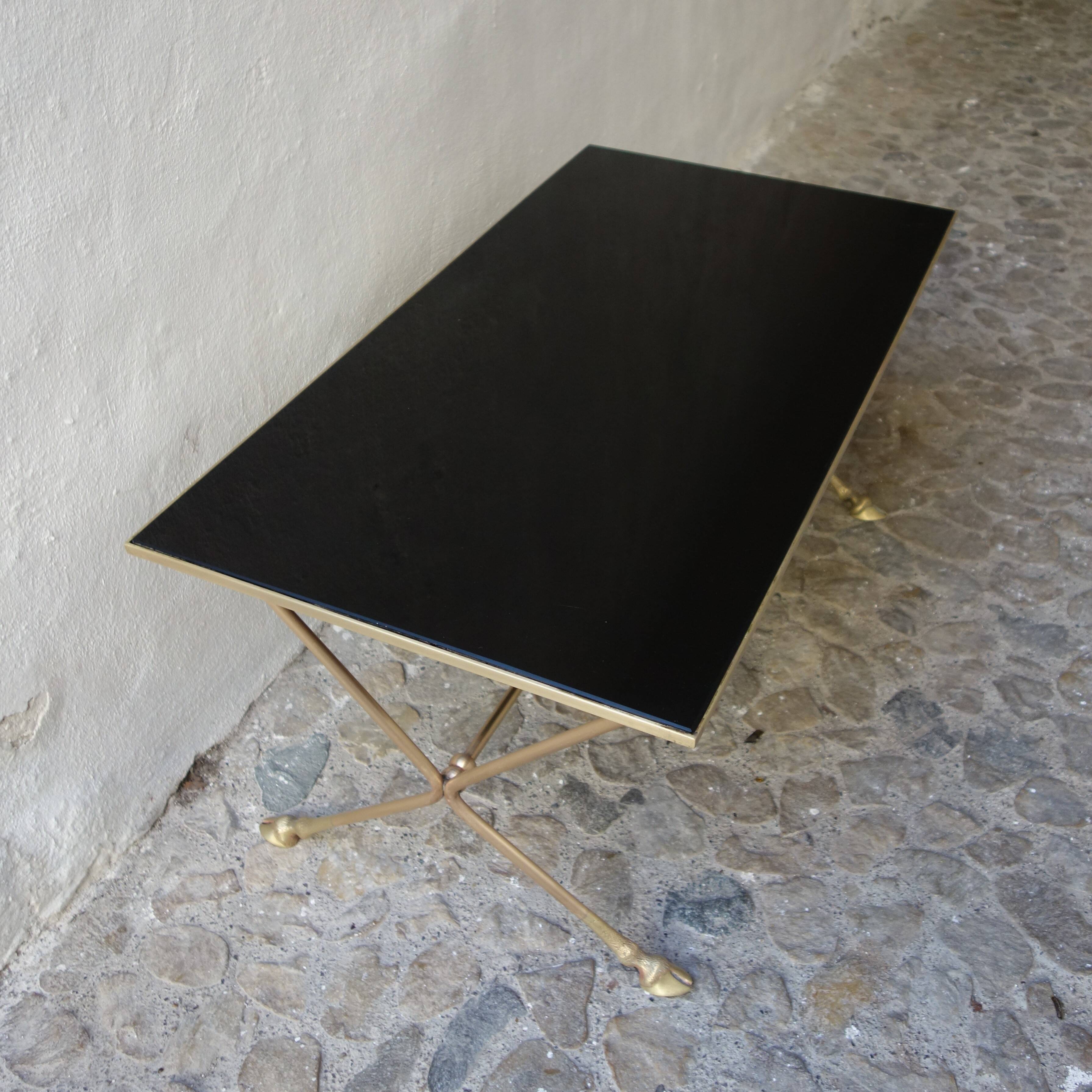 Rectangular coffee table in smoked glass and brass, animalist legs