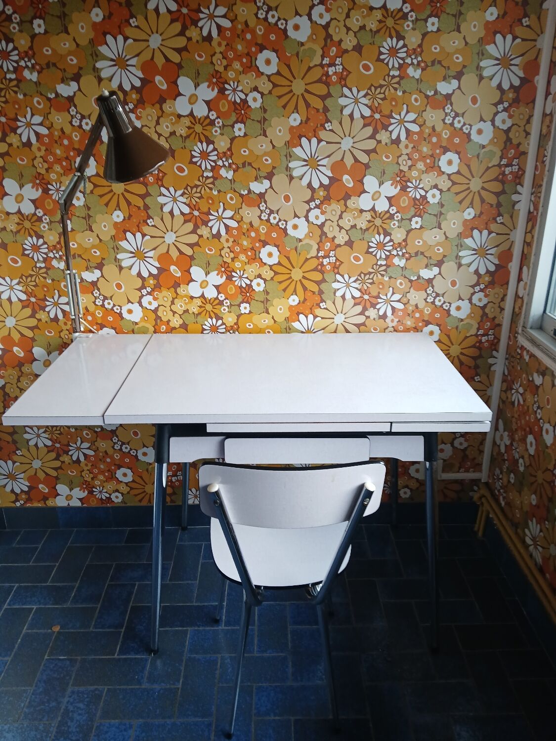 Extendable formica table and vintage 1960s chairs.