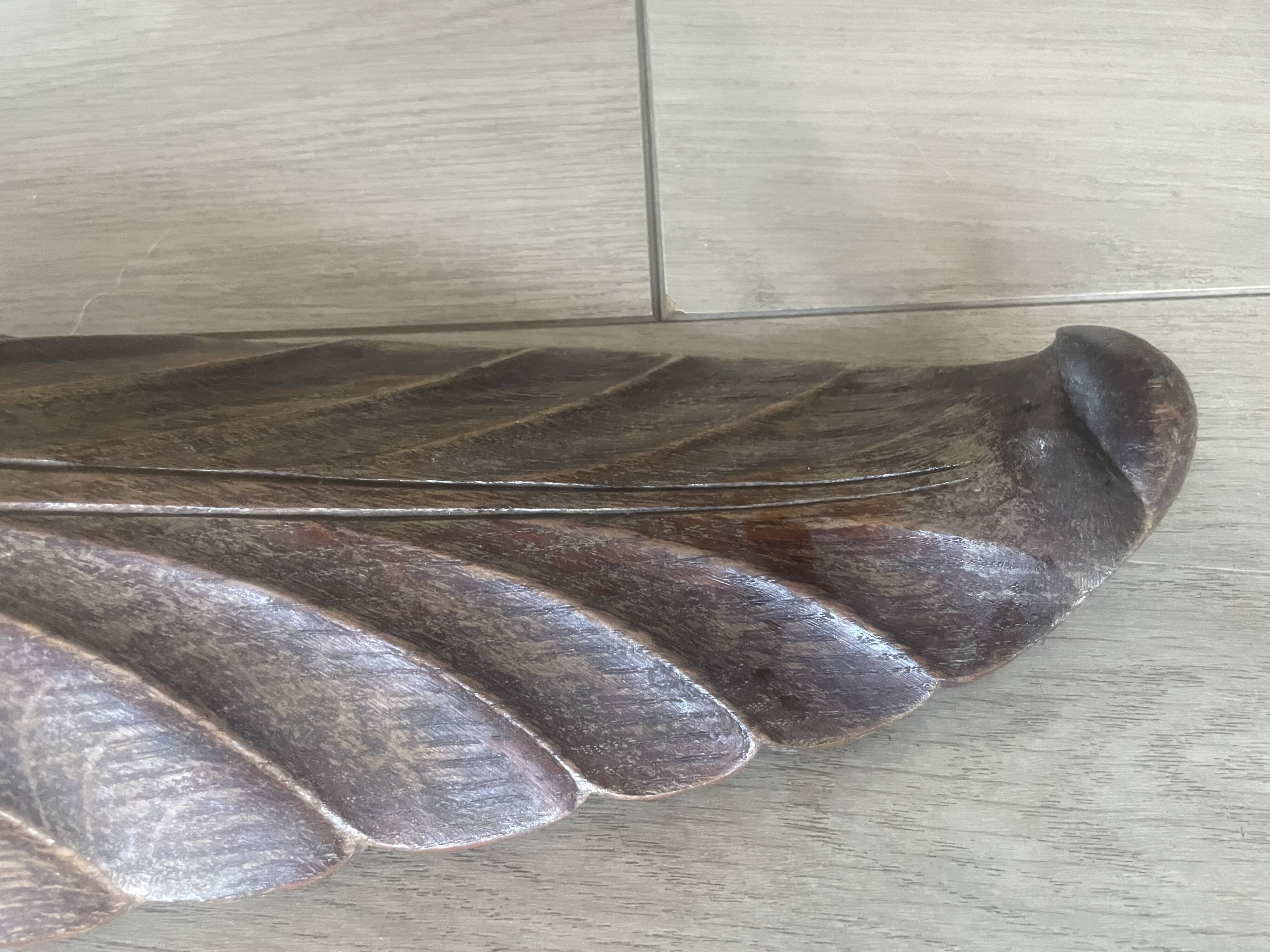 four decorative carved wooden objects