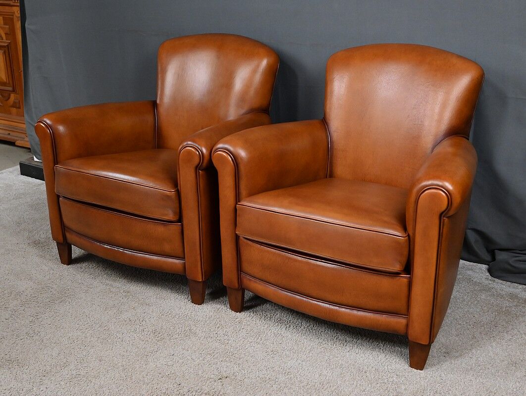 Paire de fauteuils club en cuir