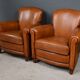 Paire de fauteuils club en cuir