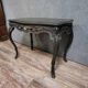 Antique desk in the Louis XV style, resting on four curved legs.
