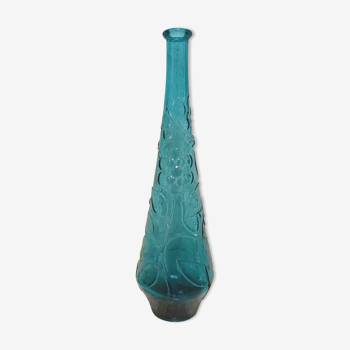 Blue pressed glass bottle decorated with flowers