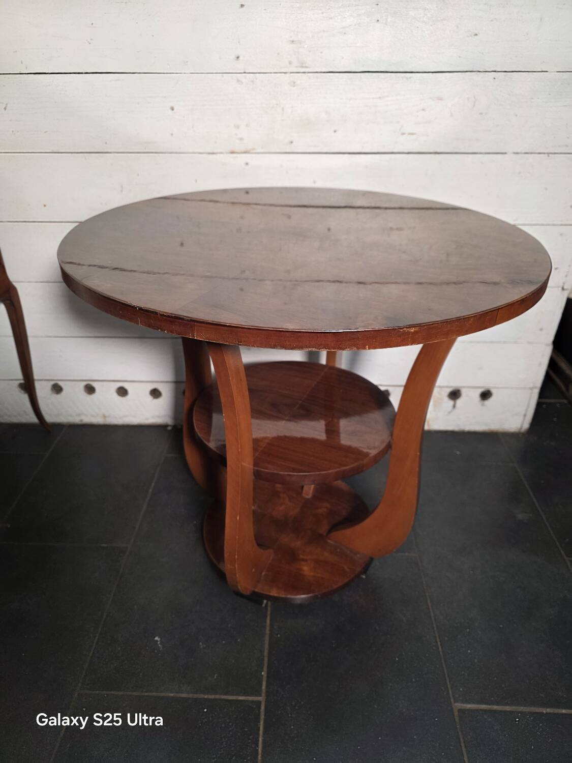 Art Deco walnut gueridon with double top from the 1930s.