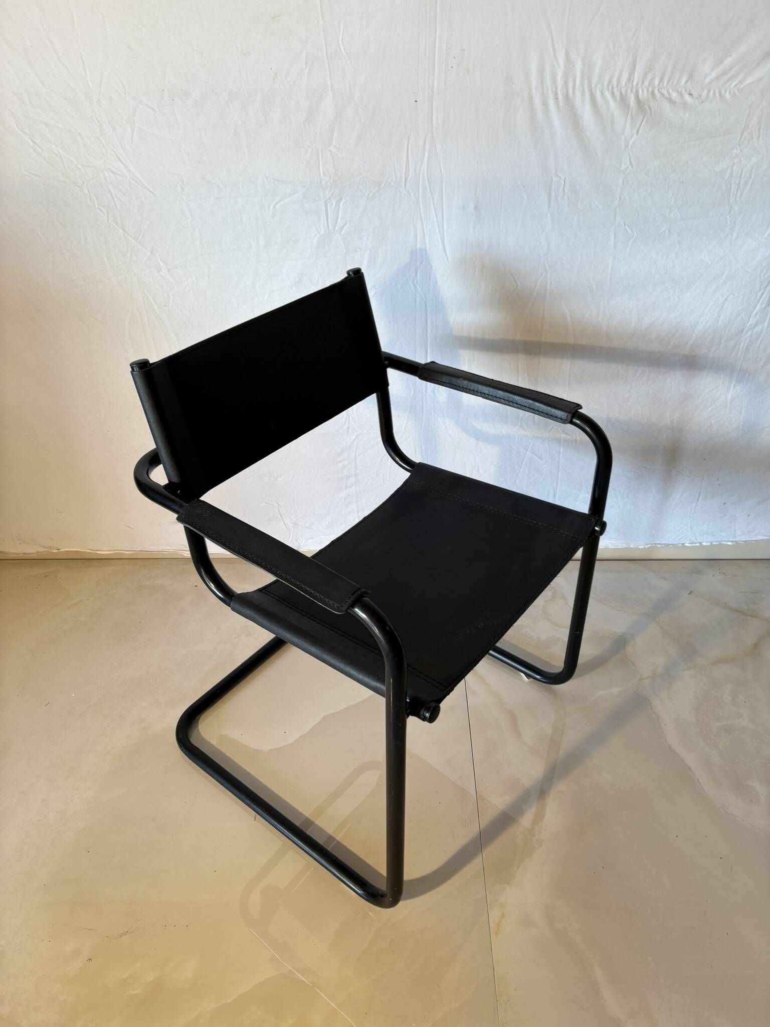 Set of 12 vintage black leather and tubular steel chairs – Italy, year