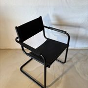 Set of 12 vintage black leather and tubular steel chairs – Italy, year