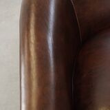luxury dark leather club chair with English-style ball feet
