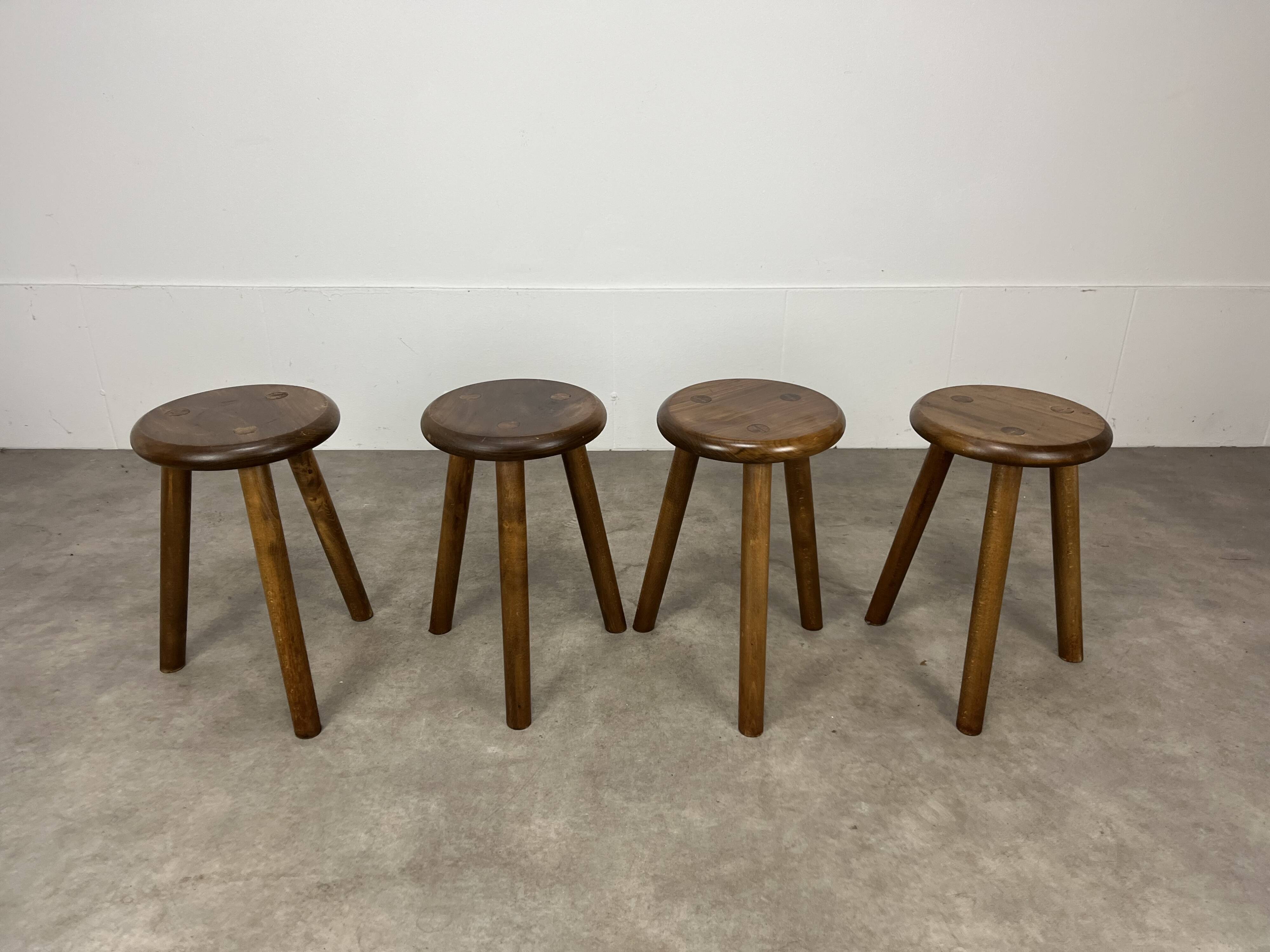 4 wooden tripod stools