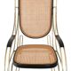 Modernist rocking chair in gilded brass and cane.