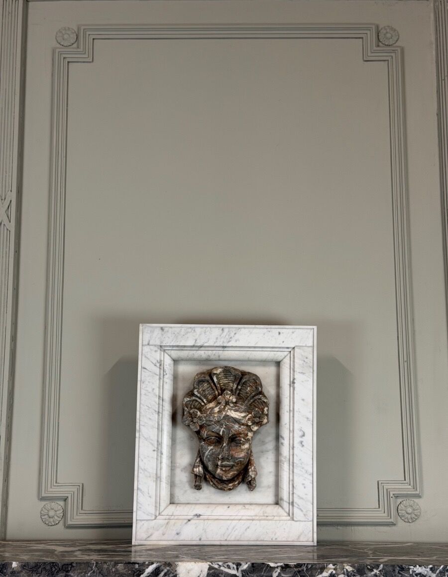 Female mascaron in grey Ardennes marble from the Regency period, 18th century.