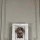 Female mascaron in grey Ardennes marble from the Regency period, 18th century.