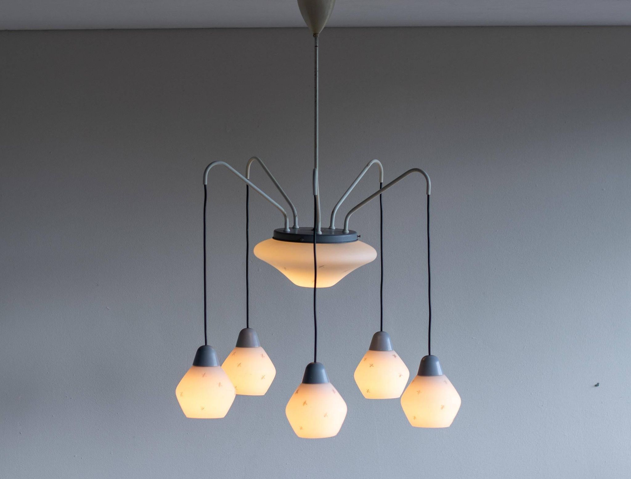 Italian brass enamelled grey chandelier with frosted glass pendants, circa 1960.