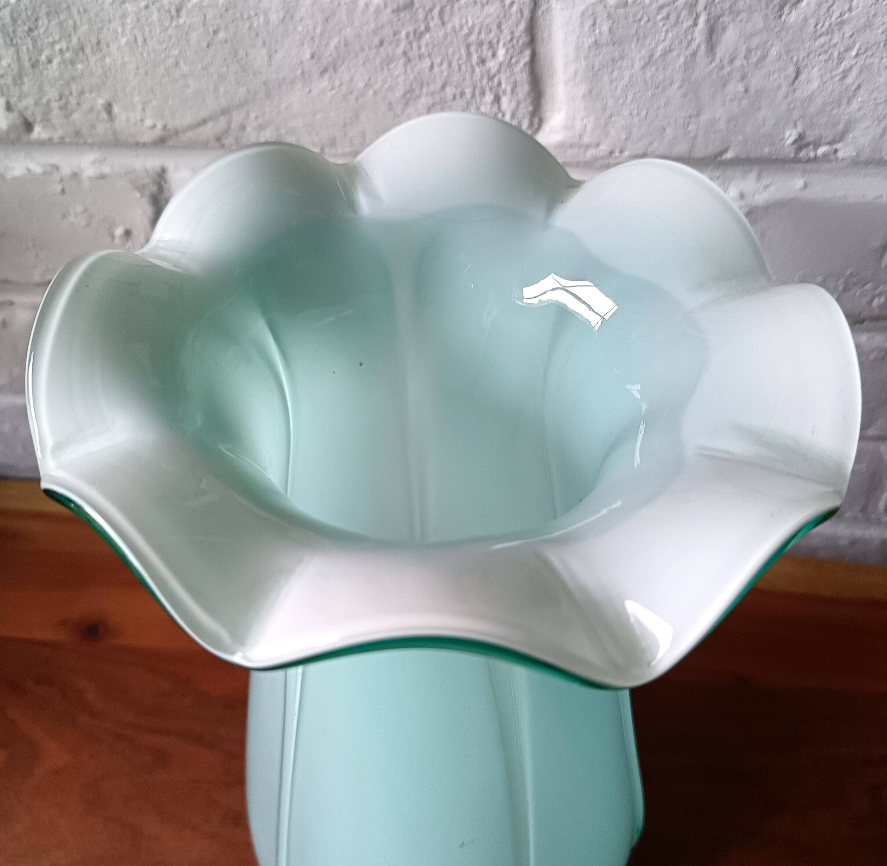 Large light blue opaline vase with a wavy neck.