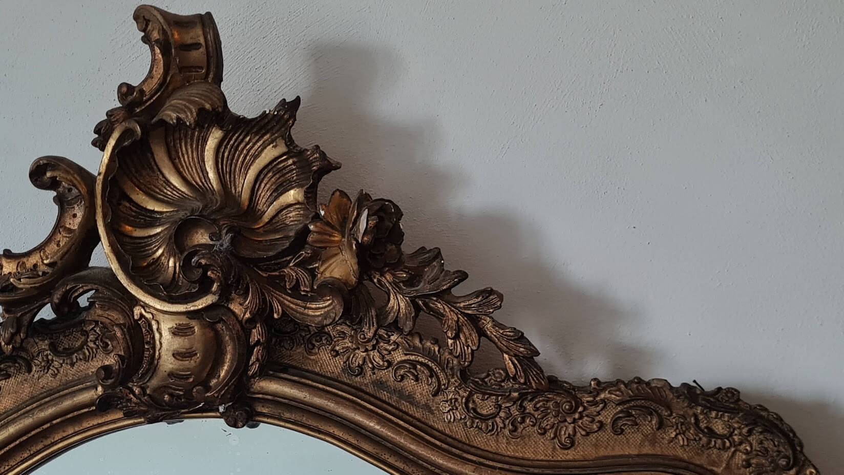 Antique Louis Philippe mirror with a pediment.