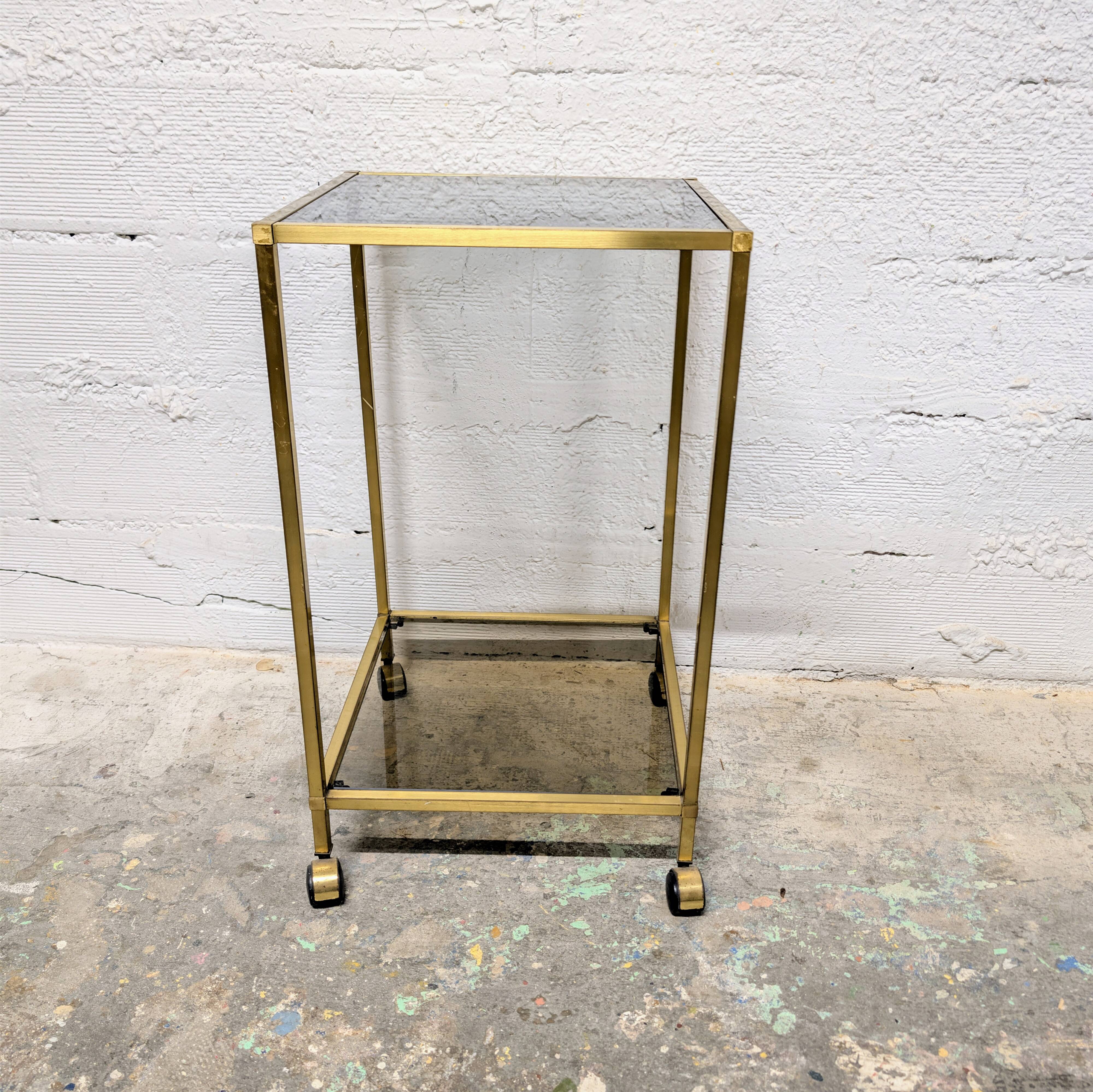 Vintage rolling table in brass and smoked glass