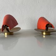 Pair of orange plexiglass and curved brass wall lights, 1950s, Germany
