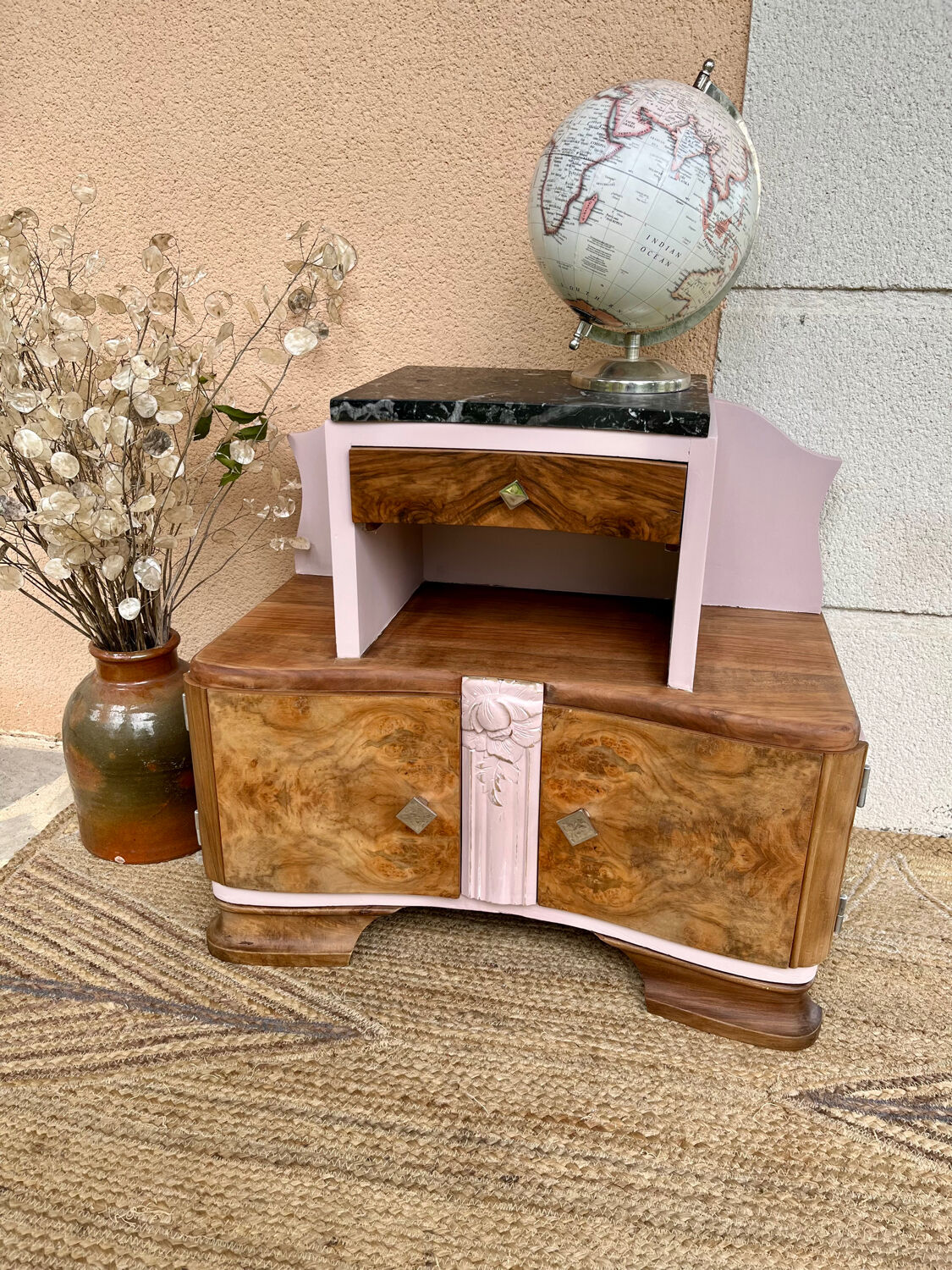 Art Deco bedside table in powder pink painted wood.