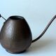 Old copper watering can with wooden handle, complete usuable, vintage from the 1960s