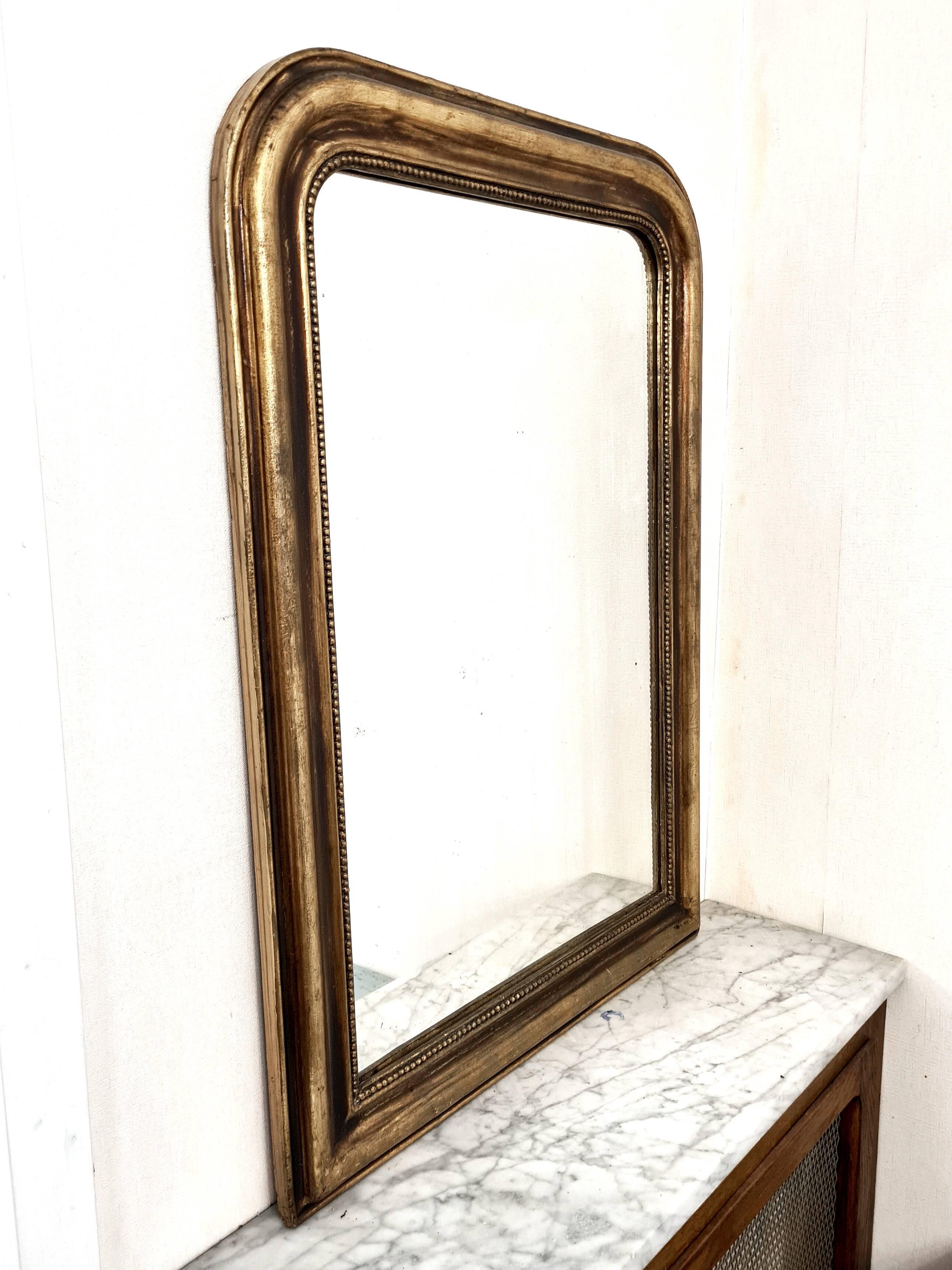 Antique Louis-Philippe gilded mirror “Apoline”