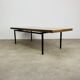 1950s modernist coffee table, wood and black metal.