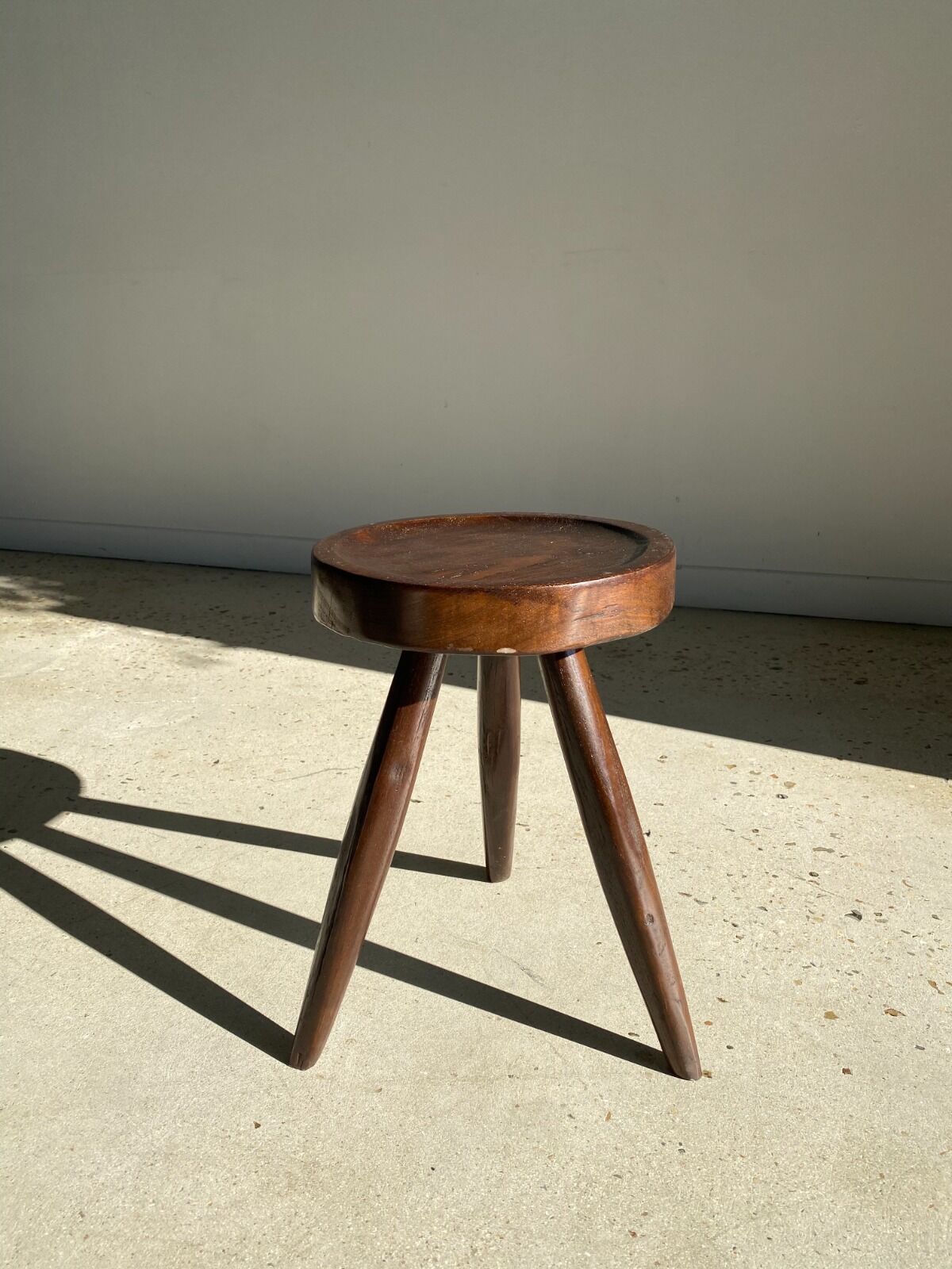 Brown solid wood stool seated circular dug